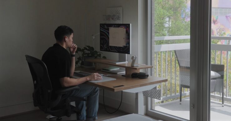 Guy sitting in a chair using a computer